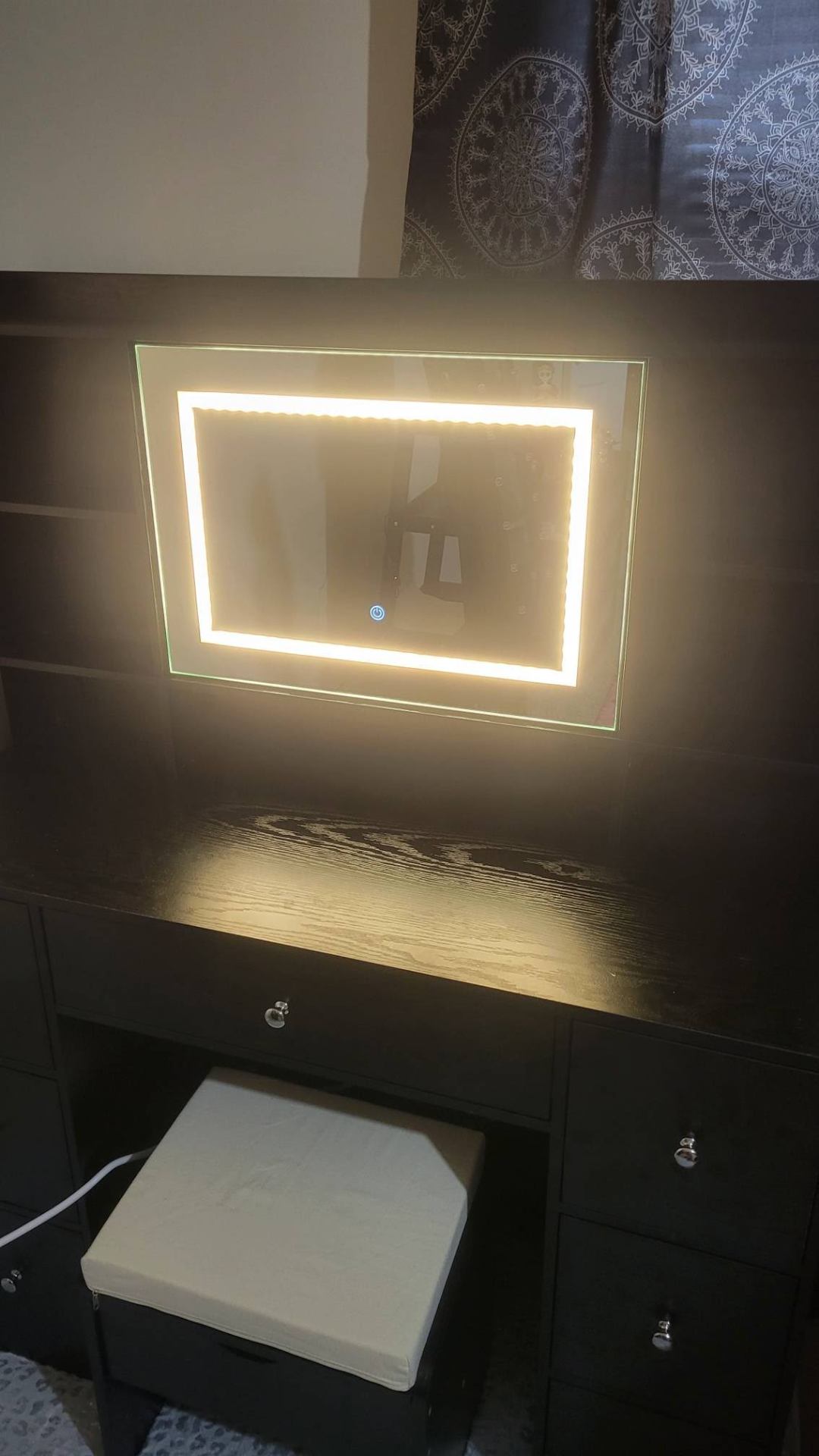 Black vanity with illuminated mirror assembled in Portsmouth by Blanchard Home Services